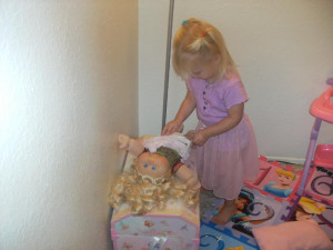 Changing baby's diaper Image