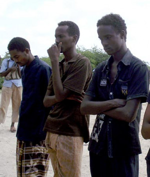 Men await their double amputation as punishment for theft in Somalia.