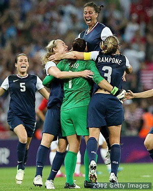 WEMBLEY, England -- Hope Solo found herself enveloped in a group hug ...