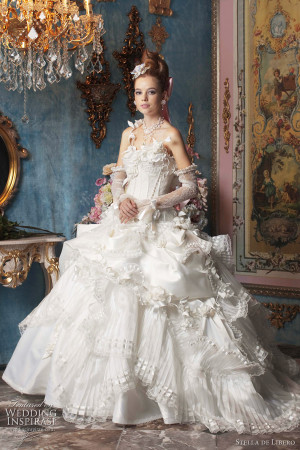 This dress has asymmetric ruffles on the skirt and heavily beaded ...