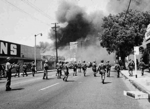 toward smoke on the horizon during the street fires of the Watts Riots ...