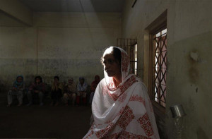 Shahida Begum, 37, who has a degree in Arts, sits in a ward at the ...