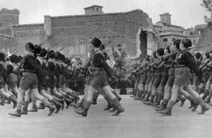 Photograph:A Fascist youth group parades past Benito Mussolini, in ...