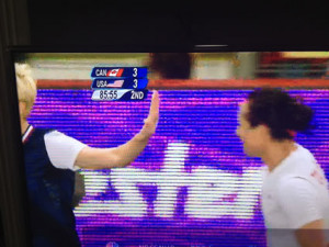 Megan Rapinoe Puts Up Her Hand to the Face of Canadian Player