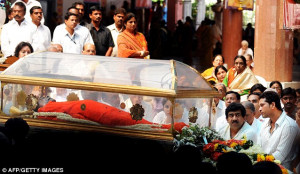 Sombre: Sathya Sai Baba's body was displayed in a transparent coffin ...