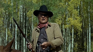 ... Wayne as one-eyed marshal Rooster Cogburn, one of his signature roles