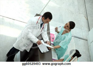Medical secretary showing record to doctor