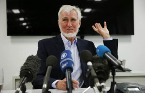 Professor John O'Keefe answers a question during a news conference in ...