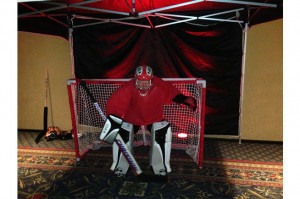 Guests test their hockey skills against a live hockey goalie. Includes ...