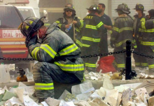 NEW YORK - SEPTEMBER 11, 2001: A firefighter breaks down after the ...