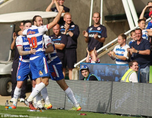 Glenn Murray wheels away in delight with his Reading team-mates after ...