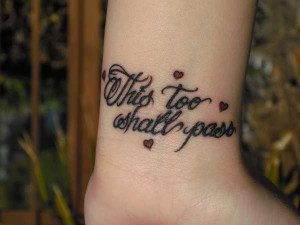 Cursive Font Wrist Tattoo with Hearts