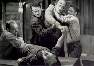 Of Mice and Men - Lennie being restrained - crushing Curley's hand.