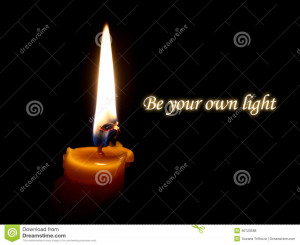 Be your own light quote, candle flame on a black background.