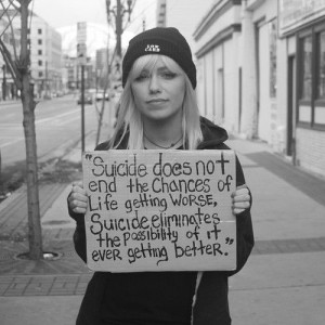 Jenna McDougall holding the Suicide Sign