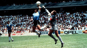 ... : Diego Maradona famously punches the ball past Peter Shilton in 1986