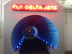 and first ceo c e woolman the display includes a portrait of woolman ...