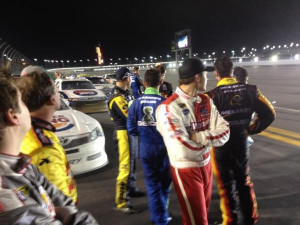NASCAR drivers in the back stretch during the delay of the race as the ...