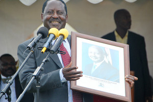 Minister Raila Odinga auctioning President Yoweri Kaguta Museveni ...