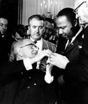 President Johnson signs Civil Rights Act, hands pen to Dr. Martin ...