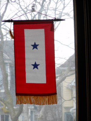 Our family's Double Blue Star Banner hanging in our front window shows ...