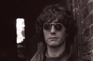 Paul McGann in driving mode, West London, 1986. © Murray Close