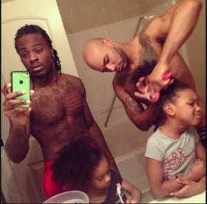picture of two black, gay fathers preparing their daughters for school ...