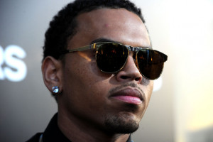 ... Stud Earrings and Short Curls Hairstyle for Black Men from Chris Brown