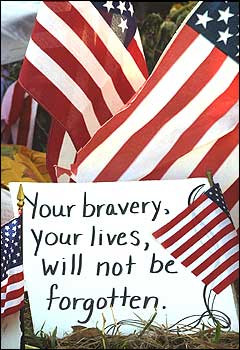 note rests among American flags at a memorial near the Flight 93 ...