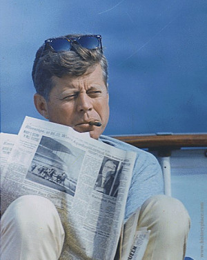 John F. Kennedy smoking a cigar.