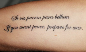 ... for war: Angel's tattoo includes a helpful translation of the latin