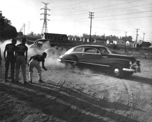 ... show how illegal street racing is done in this photo from 1954