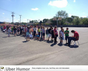 Elementary school students line up for a yearbook signature from the ...
