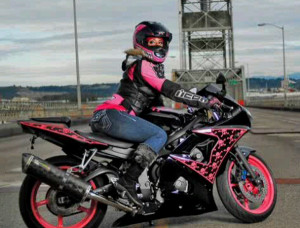 Stephanie perches confidently on her very first bike— a pink and ...