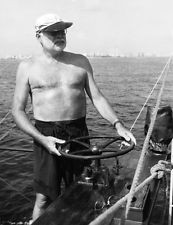 ... Reprint 16 by 21 inches Ernest Hemingway at Helm of Pilar Cuba 1950s
