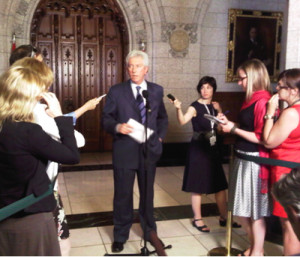 ... podium away. Gilles Duceppe and Tom Mulcair had to make do without