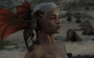 Daenerys with one of her newly-hatched dragons.