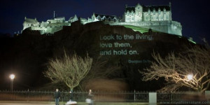Edinburgh Castle lit up with a quote from Douglas Dunn's poem ...