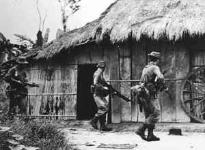 Australian soldiers search a village for Vietcong