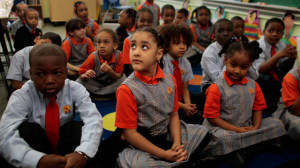 Students sit patiently at Harlem Success School, praised in the book ...