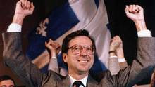 Robert Bourassa raises his arms in victory after leading his Liberals ...