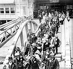 Immigrants coming ashore, CA. 1920.