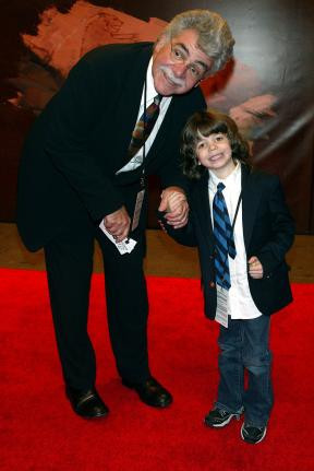 Joel Siegel and son Dylan pose for pictures at the premiere of