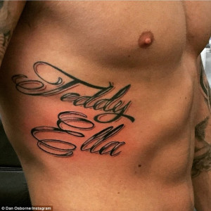 ... name onto his torso as he and Jacqueline Jossa celebrate her arrival