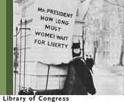 Suffragist with banner