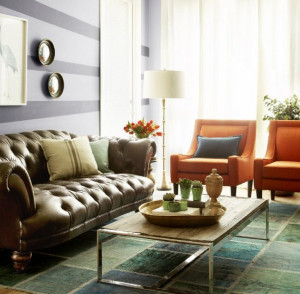 Love the mismatched living room seating and the orange chairs with ...