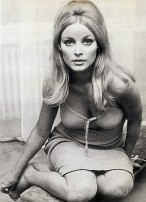 Murderer: Charles Manson pictured left with shaven hair and a swastika ...