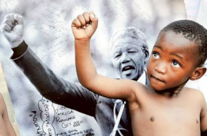 ... Human Rights Day. Pictured here: A young child models Nelson Mandela