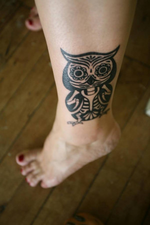 nice tribal style owl tatoo on leg on woman