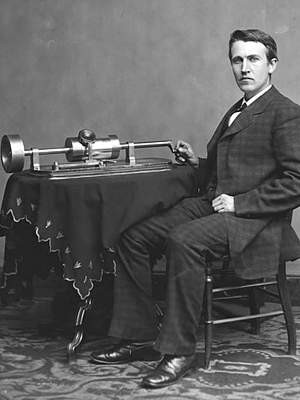 Thomas Edison photo - seated beside tinfoil phonograph on table